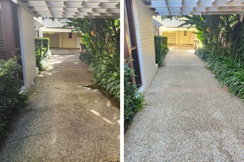 Pebbled concrete driveway before and after pressure cleaning